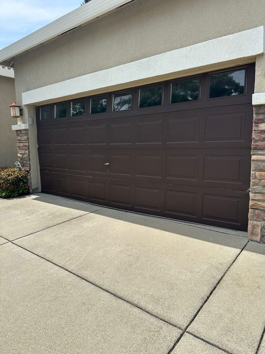 New brown carriage style garage door installed by Speedy G's
